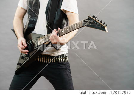 Man playing on electric guitar 120117952