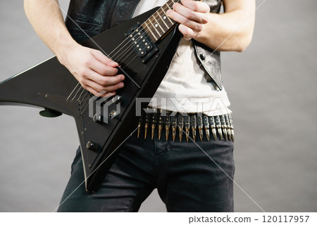 Man playing on electric guitar 120117957