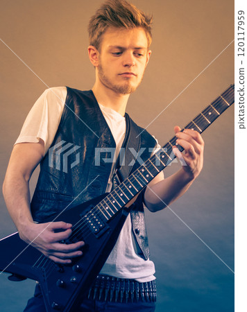Man playing on electric guitar Man playing on electric guitar 120117959