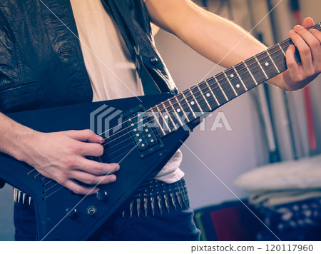 Man playing on electric guitar 120117960