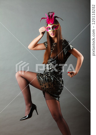 woman with carnival mask on gray woman with carnival mask on gray 120118282