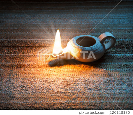 Ancient lamp shines in the dark 120118380