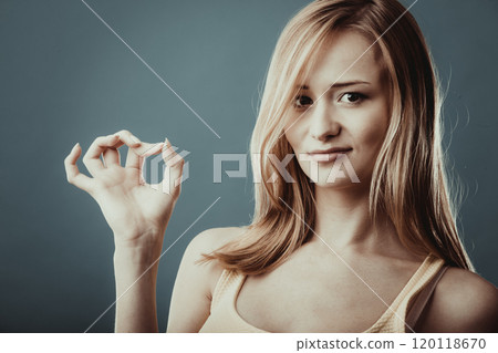 Woman showing ok hand sign gesture 120118670