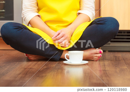 Woman with cup of coffee in kitchen. Woman with cup of coffee in kitchen. 120118980