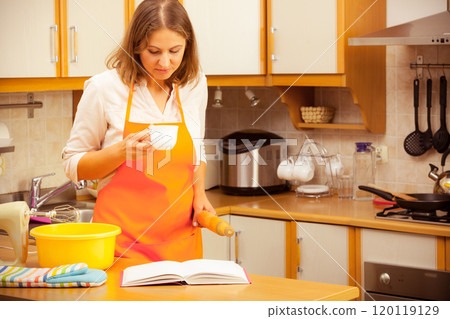 Housewife planning and preparing meal 120119129