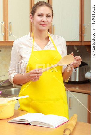 Housewife planning and preparing meal 120119132