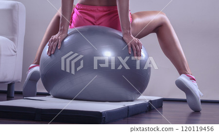 woman doing fitness exercises with fit ball woman doing fitness exercises with fit ball 120119456