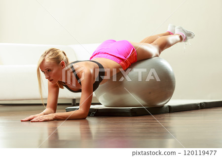 woman doing fitness exercises with fit ball woman doing fitness exercises with fit ball 120119477