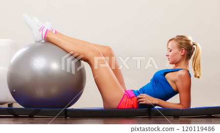 woman doing fitness exercises with fit ball woman doing fitness exercises with fit ball 120119486