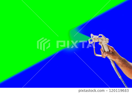 Professional Spray Painter Holding Spray Gun Spraying Surface Against Green and Blue Screen Chroma Key Background. 120119683