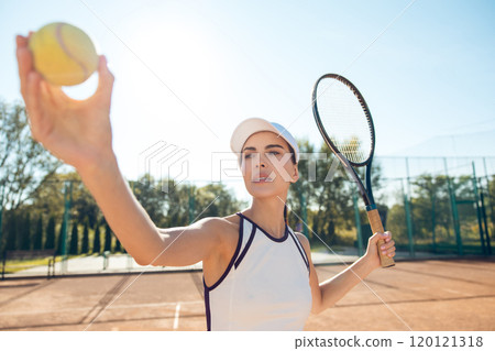 Female tennis player in white clothes exercising on the tennis courts Female tennis player in white clothes exercising on the tennis courts 120121318