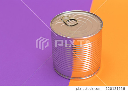 Unopened Tin Can on Split Orange and Violet Background 120121636