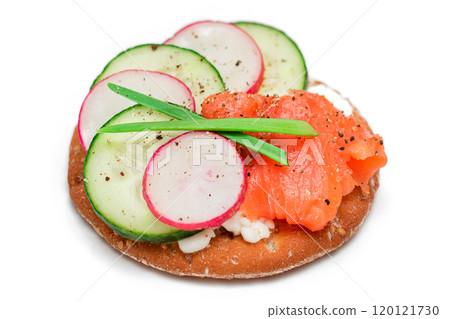 Cracker Sandwich with Salmon, Cucumber, Radish, Cottage Cheese and Green Onions - Isolated 120121730