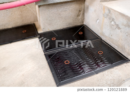 Sticky mousetraps set up along the walls of buildings 120121889