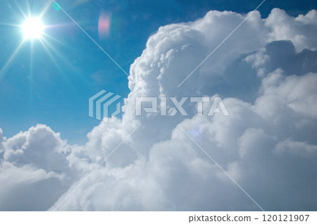 Large white clouds with blue sky and sun. Large white clouds with blue sky and sun. 120121907