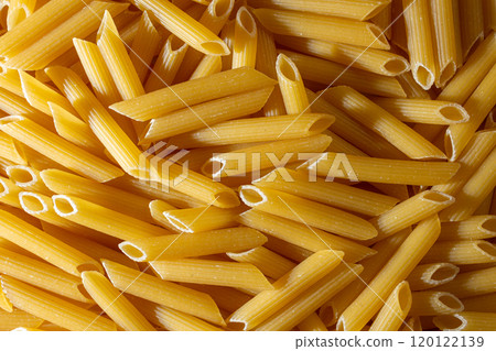 Uncooked Penne Rigate Pasta Background Uncooked Penne Rigate Pasta Background 120122139