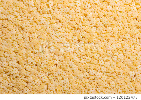 Uncooked Stelline Pasta Background Uncooked Stelline Pasta Background 120122475