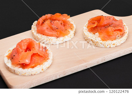 Tasty Rice Cake Sandwiches with Fresh Salmon Slices Tasty Rice Cake Sandwiches with Fresh Salmon Slices 120122476