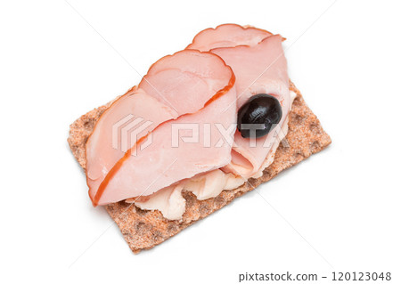 Whole Grain Crispbread with Ham, Cream Cheese and Olives - Isolated 120123048