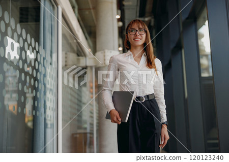 Confident Businesswoman in a Contemporary Office, Exuding Professionalism and Style 120123240