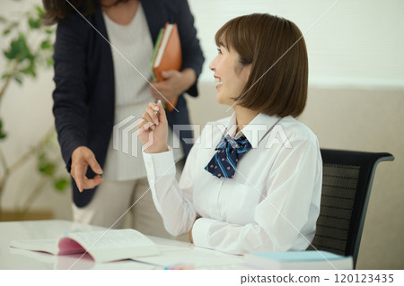 A high school girl and her teacher studying 120123435