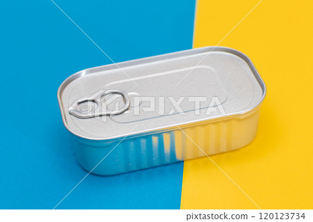 Tin Can on Split Blue and Yellow Background Tin Can on Split Blue and Yellow Background 120123734
