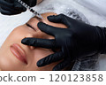 A beautician gives a woman a Botox injection. A procedure for beauty and rejuvenation. 120123858