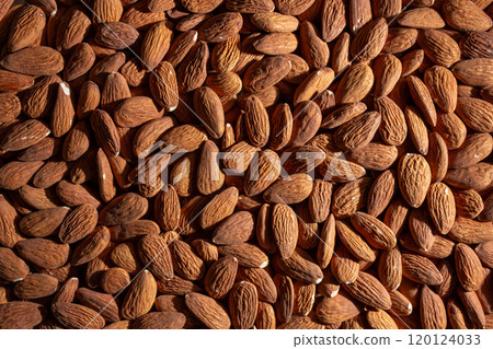 Scattered Almonds. Background from Almond Nuts Scattered Almonds. Background from Almond Nuts 120124033