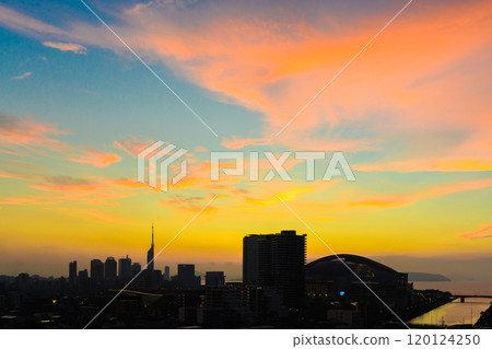 Colorful sunset of Momochihama, Jigyohama, and Fukuoka Tower in Sawara Ward, seen from the direction of Tojinmachi and Ohori Park. Pastel sunset silhouettes. 120124250