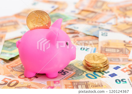 Pink Piggy Bank with Bitcoin Coin on the Fifty Euro Banknotes 120124367