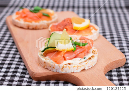 Rice Cake Sandwiches with Fresh Salmon, Cucumber, Lemon and Greens 120125225