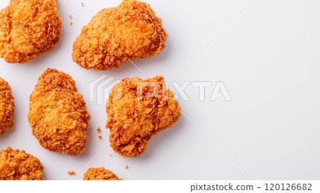 Crispy fried chicken pieces on a white isolate background. 120126682