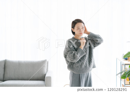 Middle woman relaxing in the room 120128291