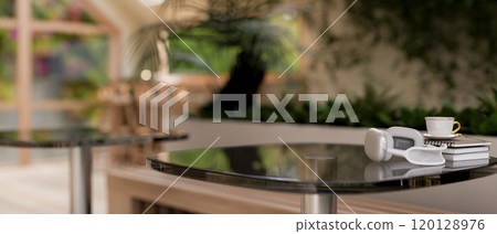A space for displaying products on a table in a contemporary coffee shop with indoors garden. A space for displaying products on a table in a contemporary coffee shop with indoors garden. 120128976