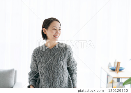 Middle woman relaxing in the room 120129530