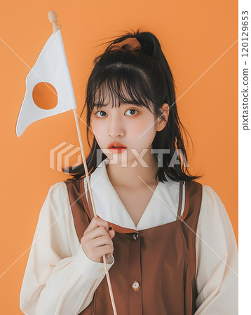 Asian woman holding Japanese flag 120129653