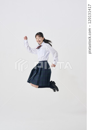 White background, Japanese female junior high school student jumping with a smile White background, Japanese female junior high school student jumping with a smile 120131417