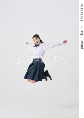 White background, Japanese female junior high school student jumping with a smile White background, Japanese female junior high school student jumping with a smile 120131419