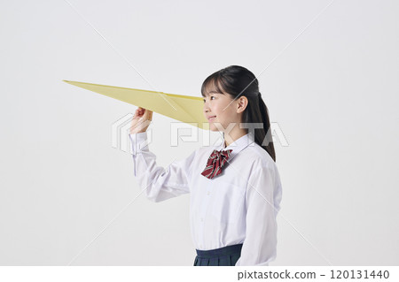White background, Japanese female junior high school student flying a large paper airplane White background, Japanese female junior high school student flying a large paper airplane 120131440