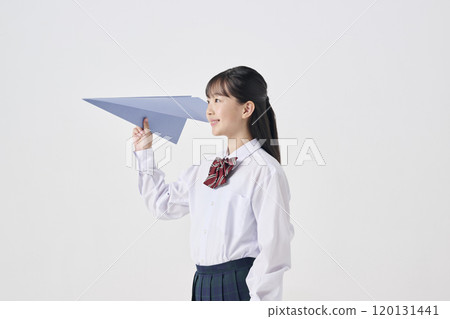 White background, Japanese female junior high school student flying a large paper airplane White background, Japanese female junior high school student flying a large paper airplane 120131441