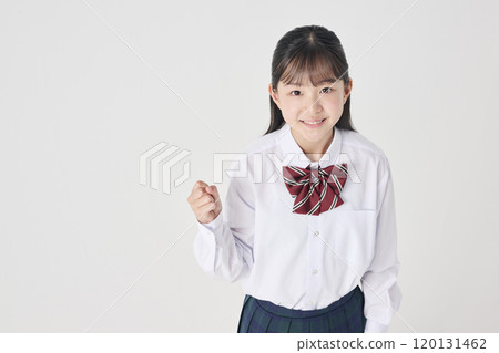 White background, Japanese female junior high school student taking a fighting pose 120131462