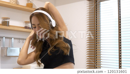 Young Sport Women look at laptop online trainer home fitness workout exercise in living room. Woman using laptop on floor in sportswear arms stretching body weight traning. Healthy lifestyle concept Young Sport Women look at laptop online trainer home fitness workout exercise in living room. Woman using laptop on floor in sportswear arms stretching body weight traning. Healthy lifestyle concept 120131601