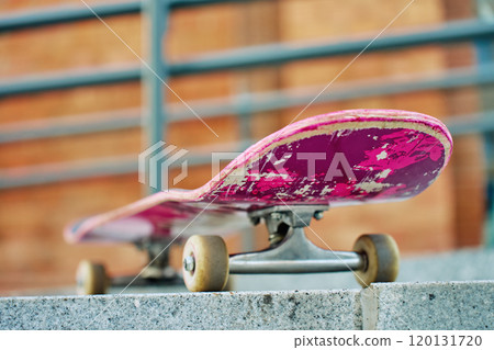 Close-Up of Worn Skateboard at city street 120131720