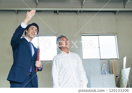 Senior man and salesman viewing a property Senior man and salesman viewing a property 120133206