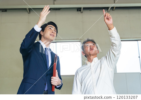 Senior man and salesman viewing a property Senior man and salesman viewing a property 120133207