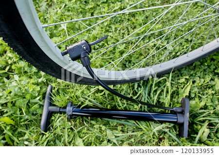 Bike tire twin head is secured to bicycle valve using lever clamp. Bike tire twin head is secured to bicycle valve using lever clamp. 120133955