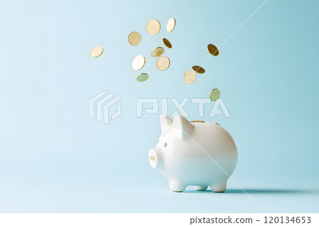 Coins falling into a piggy bank. Saving and money management 120134653