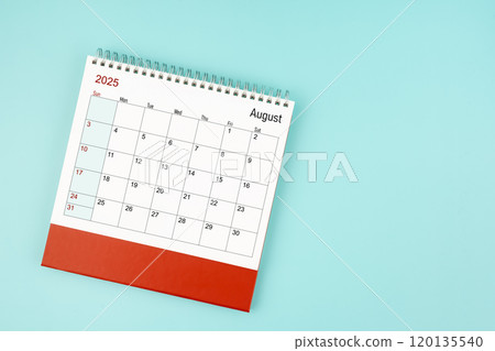 August 2025 desk calendar on blue background for your appointment. 120135540