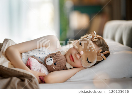 child is sleeping in the bed child is sleeping in the bed 120135656