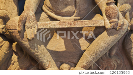 Close-up view on Ancient Stone Bas-relief Of Brahmani Or Brahmi, One Of Seven Hindu Mother Goddesses Known As Sapta Matrikas. She Is Aspect Of Adi Shakti, Possessing rajas Guna And Is Therefore Source Close-up view on Ancient Stone Bas-relief Of Brahmani Or Brahmi, One Of Seven Hindu Mother Goddesses Known As Sapta Matrikas. She Is Aspect Of Adi Shakti, Possessing rajas Guna And Is Therefore Source 120135963